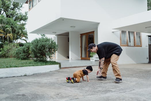 Father and son enjoying playtime outdoors in matching outfits, showcasing love and togetherness.