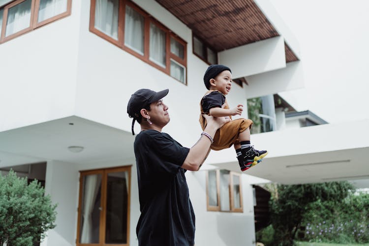 Father Lifting His Son 