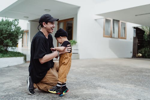 Father with Son in front of House