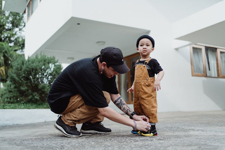 Father Tying His Sons Shoes 