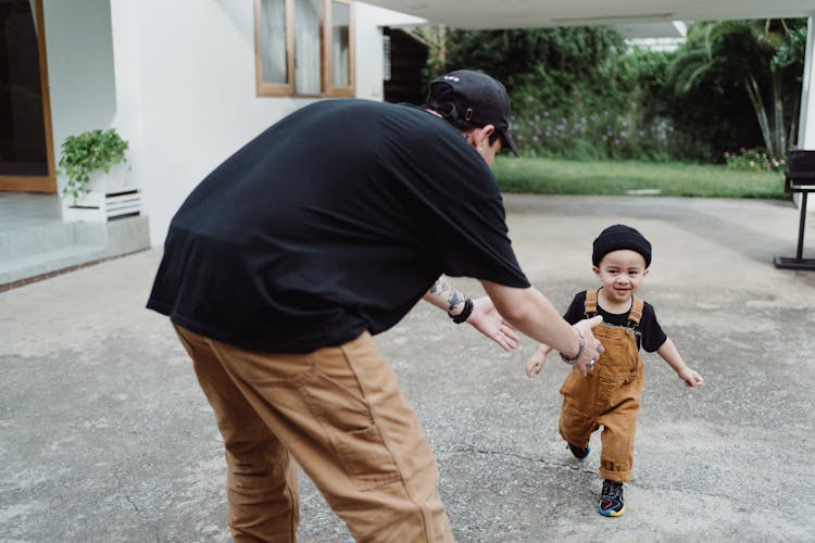 Father Catching His Running Son 