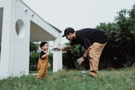Man Playing with Son in Patio