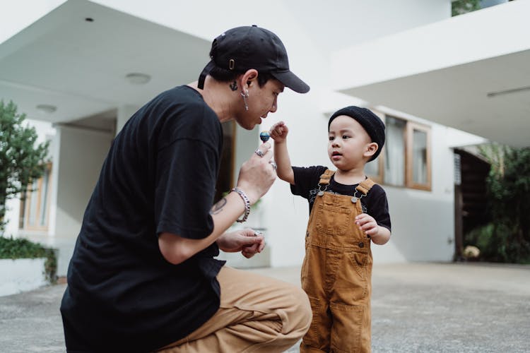 Father Negotiating Lollipop With Son