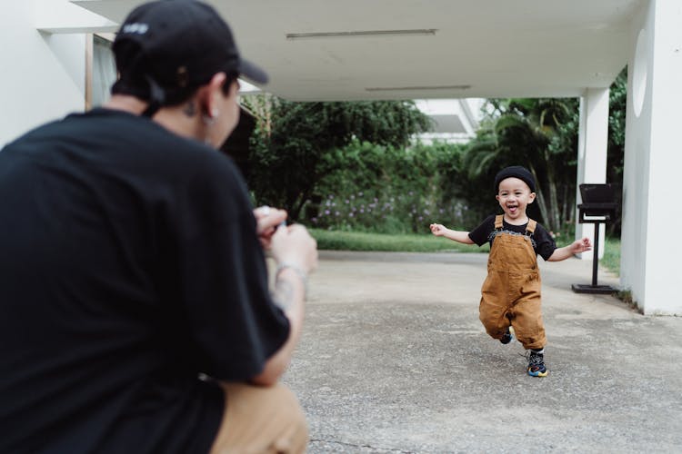 Happy Baby Boy Running Towards His Father 