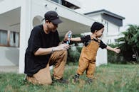 Father and Baby by House