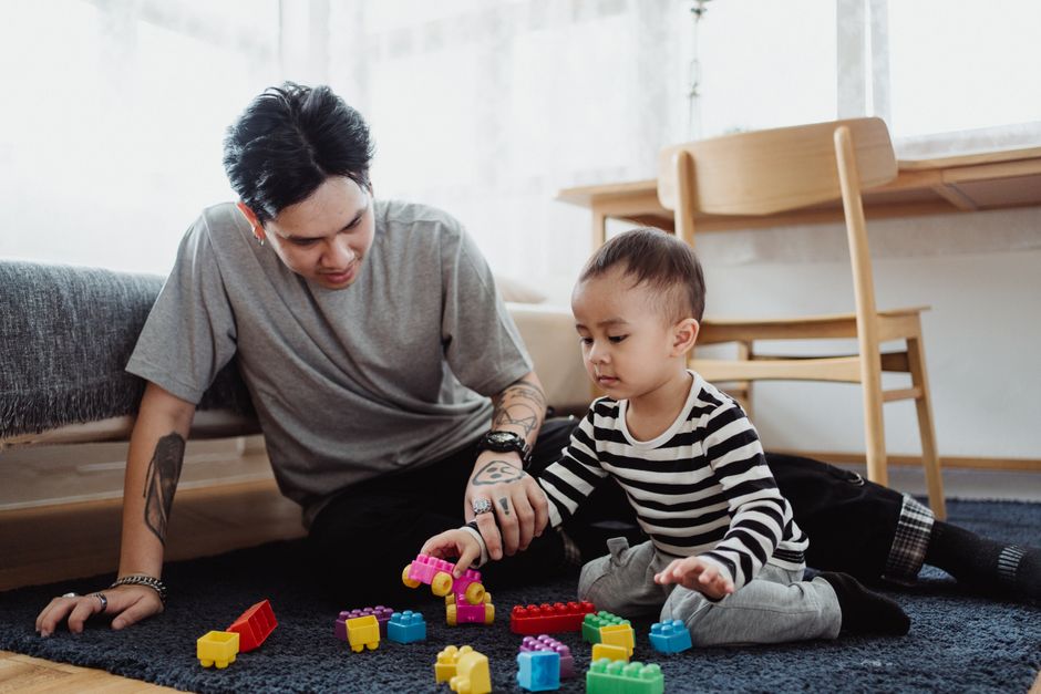 Photo by Ketut Subiyanto on Pexels A father and son playing with colorful building blocks in a cozy indoor setting. - Photo by Ketut Subiyanto on Pexels