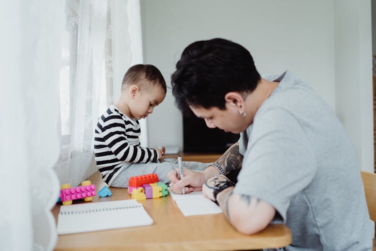 Father And Son Drawing Together 