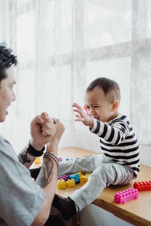 Free Man Playing with His Son Stock Photo