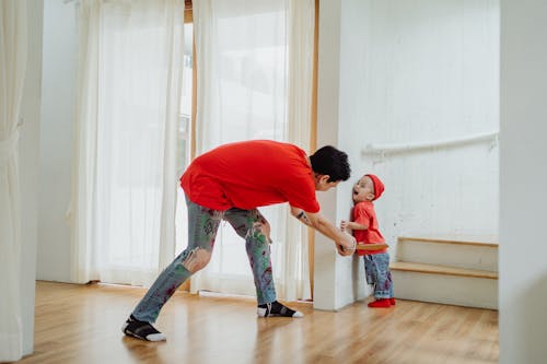 Free Father and Son Playing at Home Stock Photo