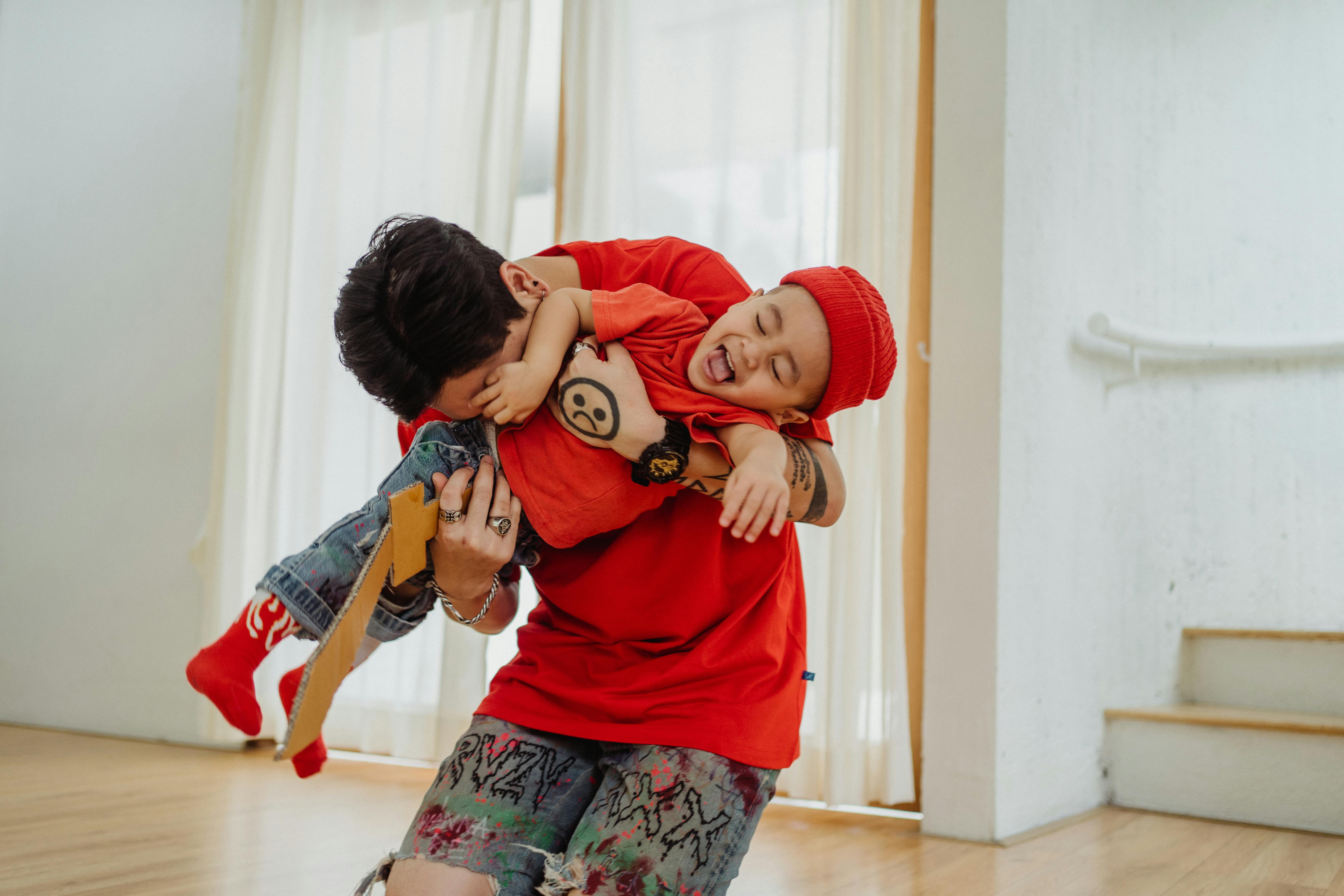 Man Carrying a Child · Free Stock Photo