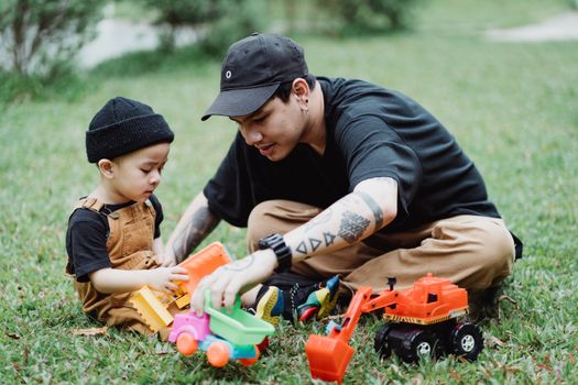 Father Playing with His Son Outdoors 