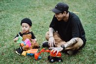Mother and Child Playing with Toys