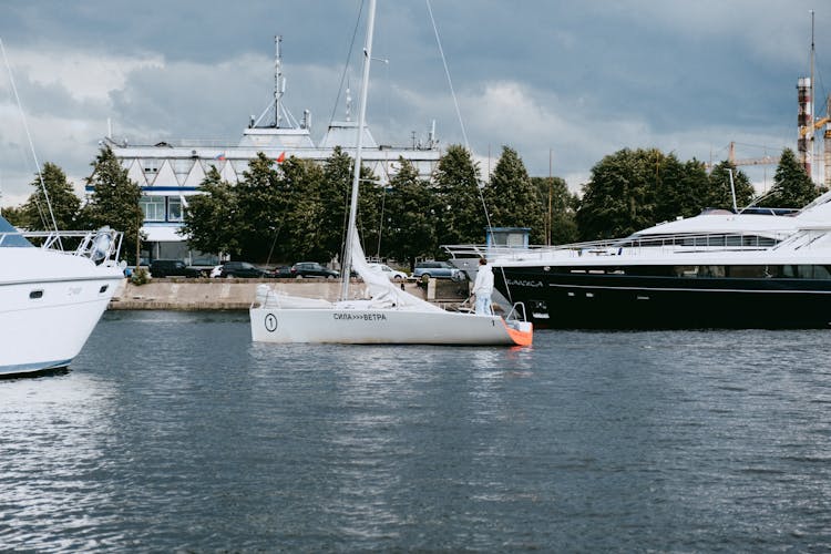 White Sail Boat On Sea