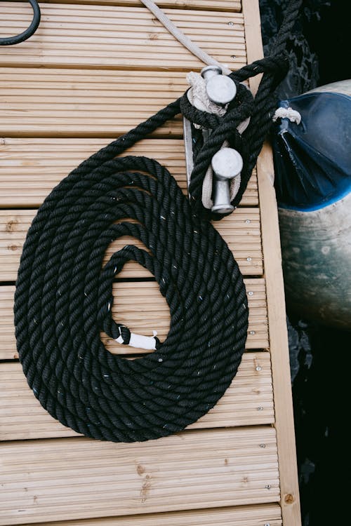 Black Rope on Brown Wooden Table
