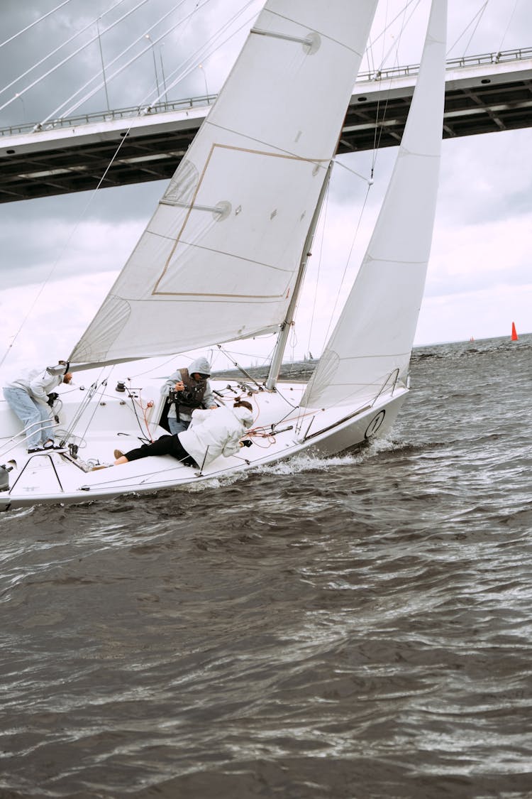 White Sail Boat On Sea