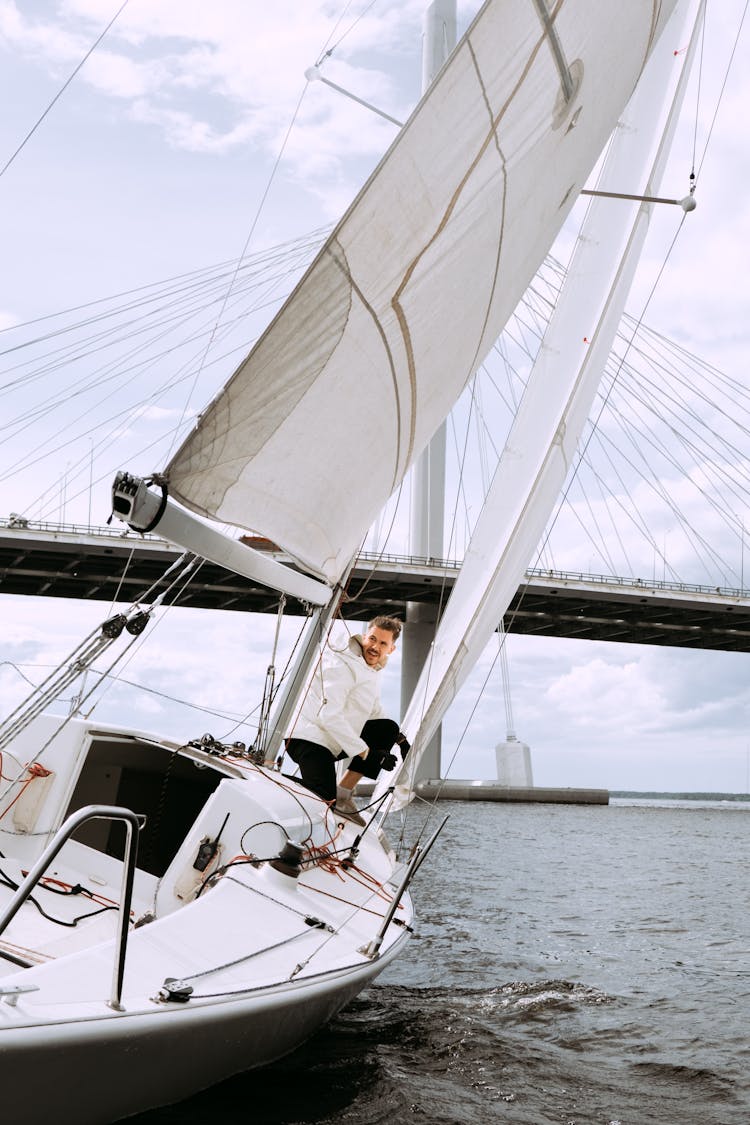 White Sail Boat On Sea