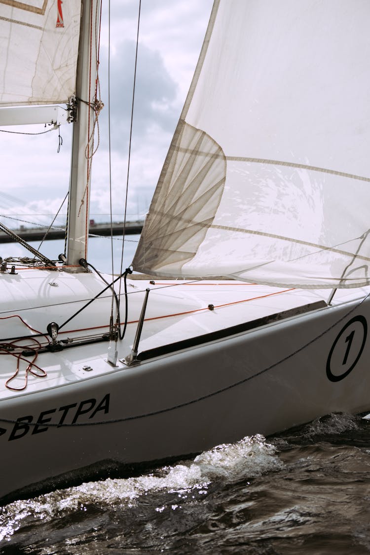 White Sail Boat On Sea