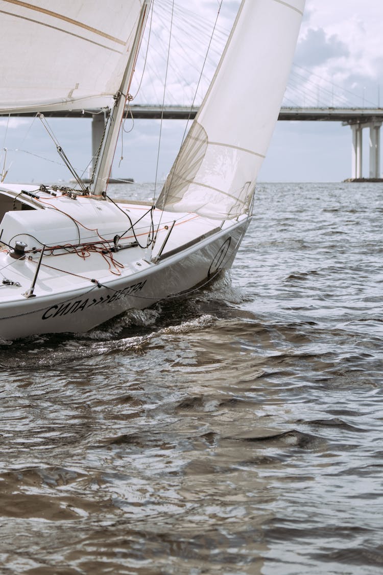 White Sail Boat On Sea