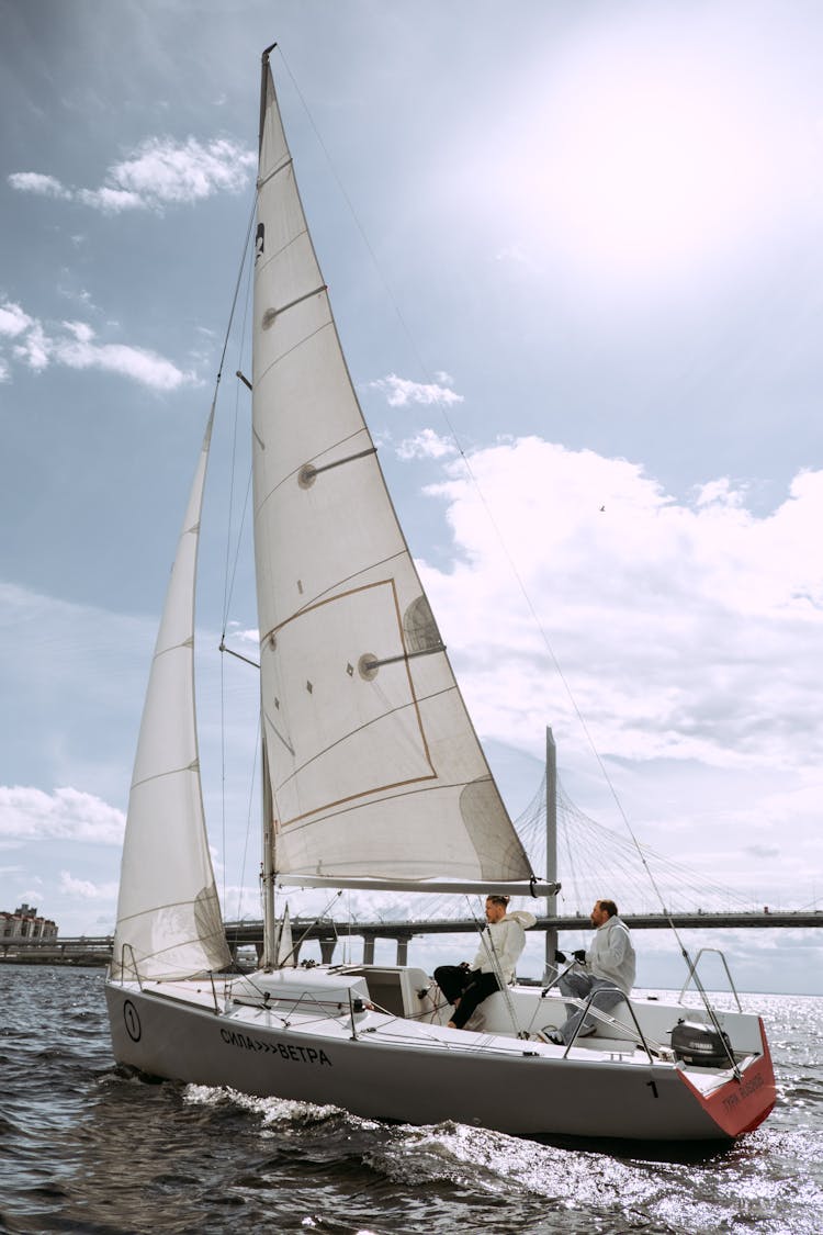 White Sail Boat On Sea