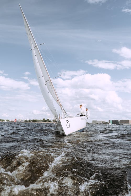 White Sail Boat on Sea