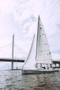 White Sail Boat on Sea Under White Sky