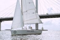White Sail Boat on Sea Dock