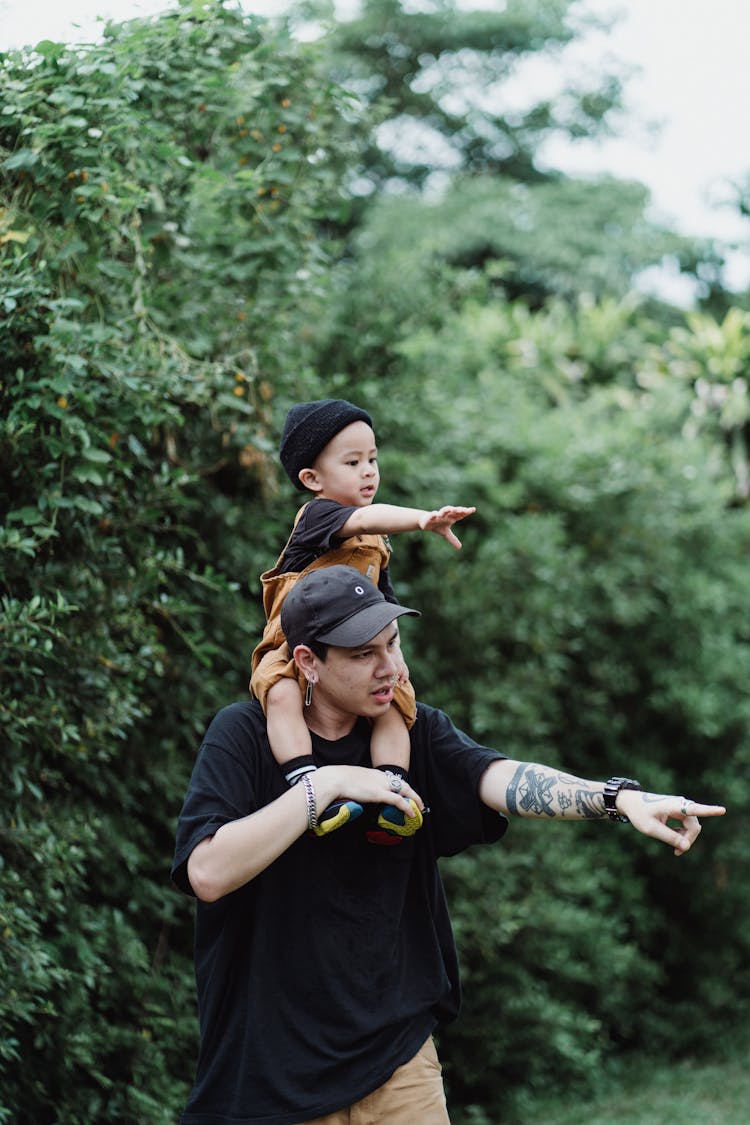 Father Carrying Son Piggyback