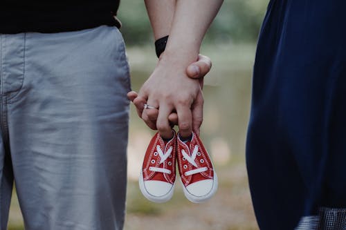 Free Close-up of Holding Baby Shoes Stock Photo