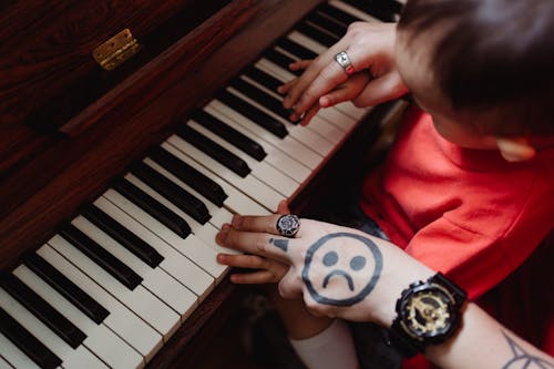 Father and Son Playing the Piano Together 