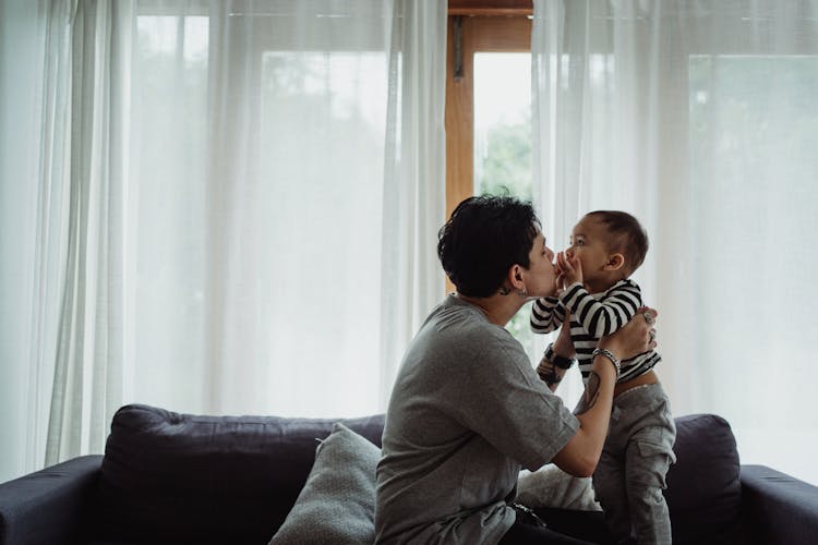 Father Kissing His Baby Son