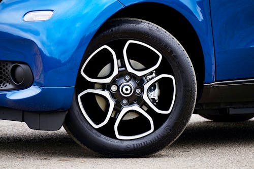 Close-up of the Wheel of a Blue Car