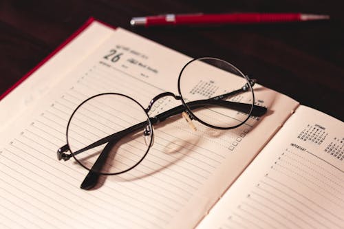Free Eyeglasses on a Notebook  Stock Photo