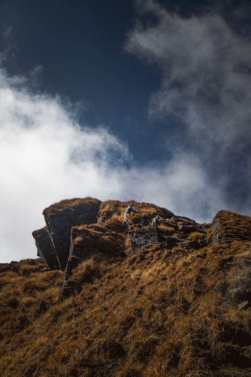 Free Captivating mountain scene with dramatic clouds and rugged terrain, perfect for nature enthusiasts. Stock Photo