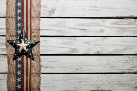 From above of ornamental star on fabric ribbon on Independence Day of USA