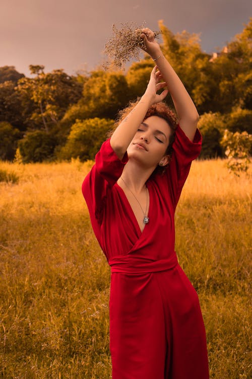 Woman Posing in Red Dress