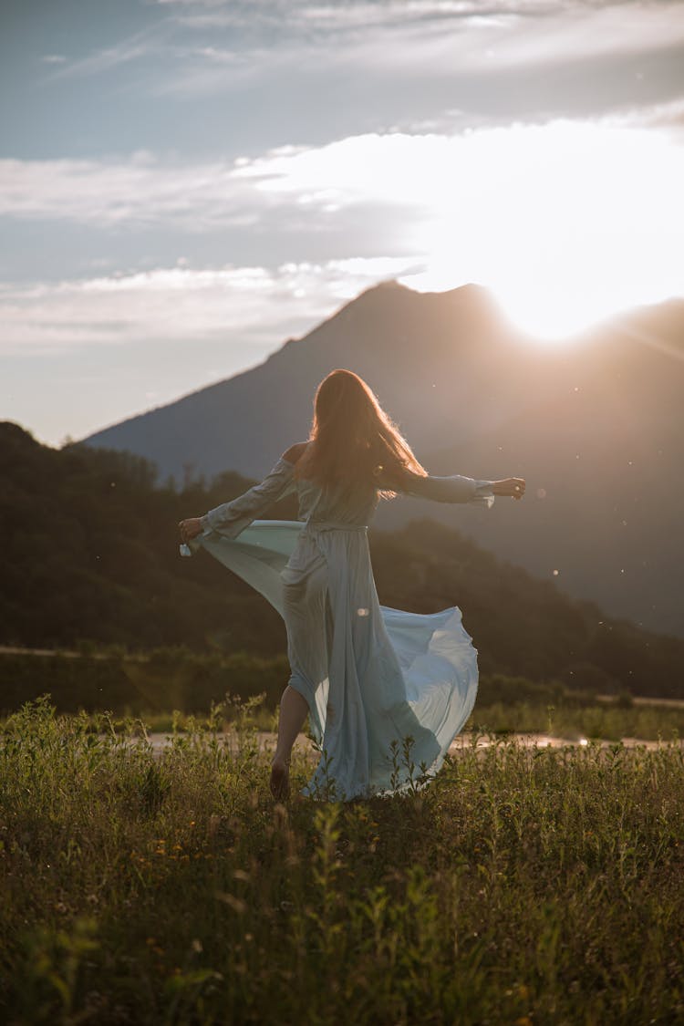 Woman In Blue Dress Spinning Around