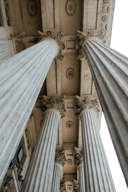 Free Low-angle view of classic ornate columns at a historic cathedral's exterior. Stock Photo