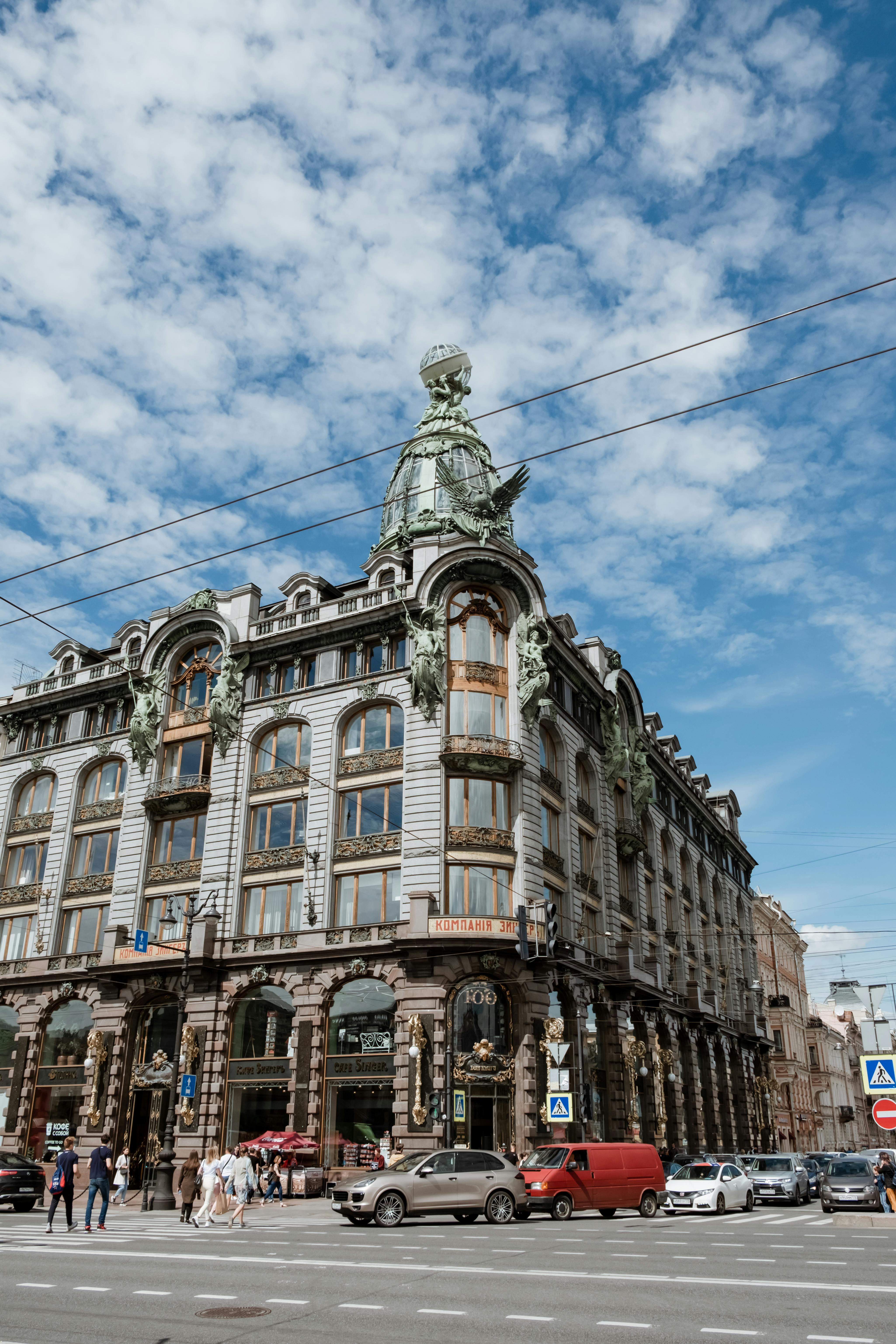 Free Iconic Singer House, an art nouveau landmark in Saint Petersburg, captured under a clear blue sky. Stock Photo