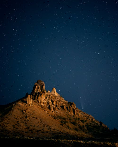 Night Sky with Comet over Desert