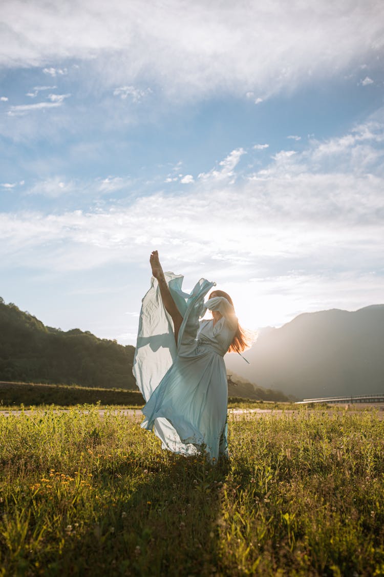 Photo Of A Woman Dancing With Her Leg Up