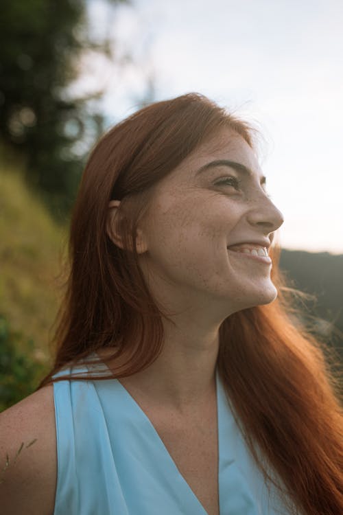 Portrait of a Woman with Red Hair Smiling