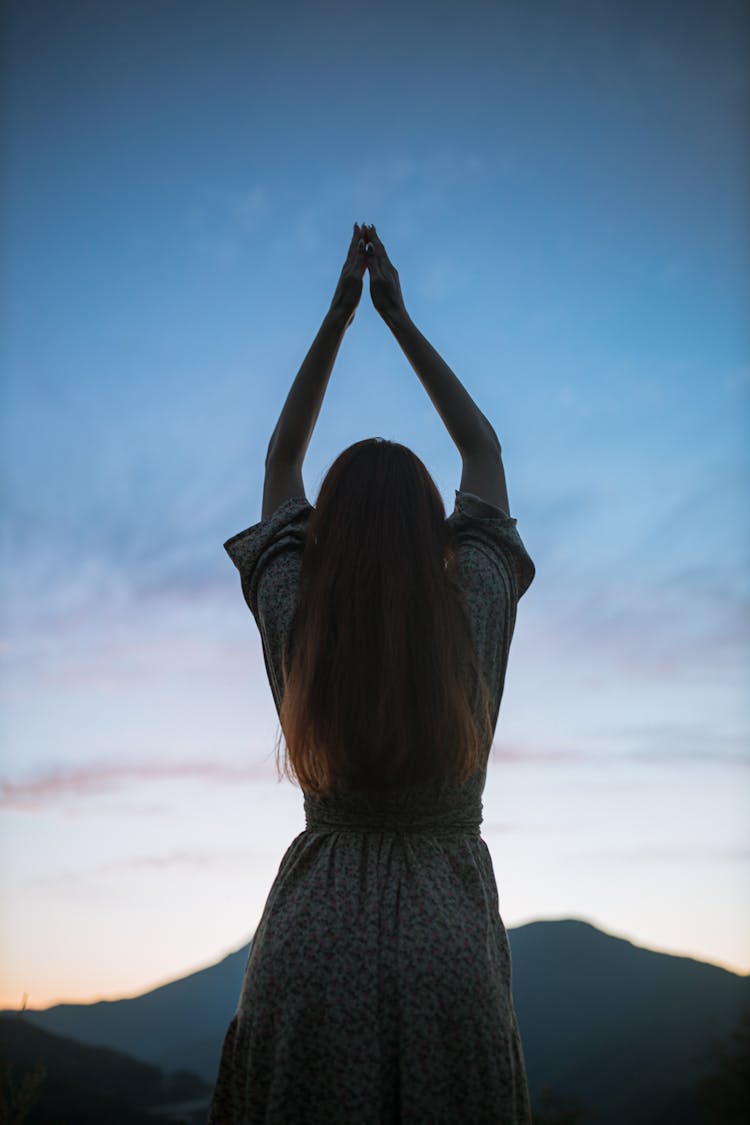 Back View Of A Woman Doing A Yoga Pose