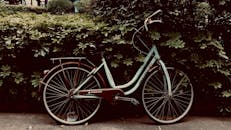 Photo of a Bicycle Beside Green Leaves
