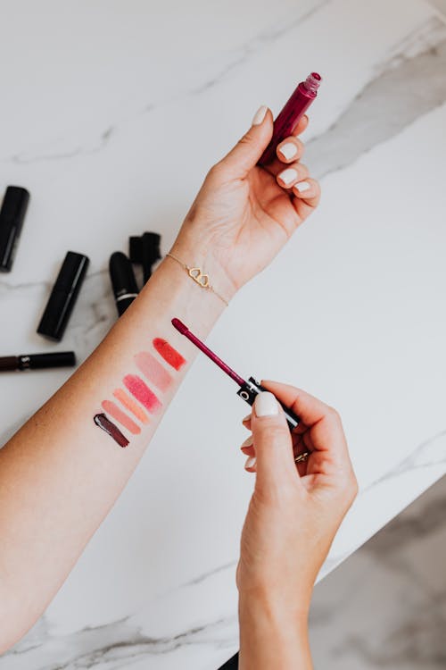 Woman Putting Mascara on Forearm