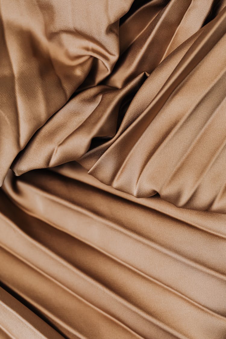 Golden Pleated Textile In Close Up Photography