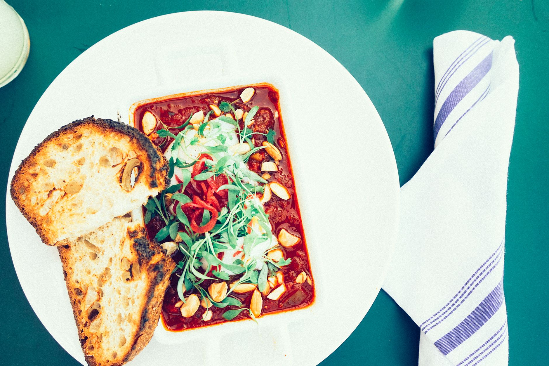 Crusty bread served with vegetable stew on the side