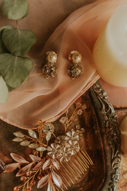Luxurious still life of pearl earrings and jewelry on vintage tray.