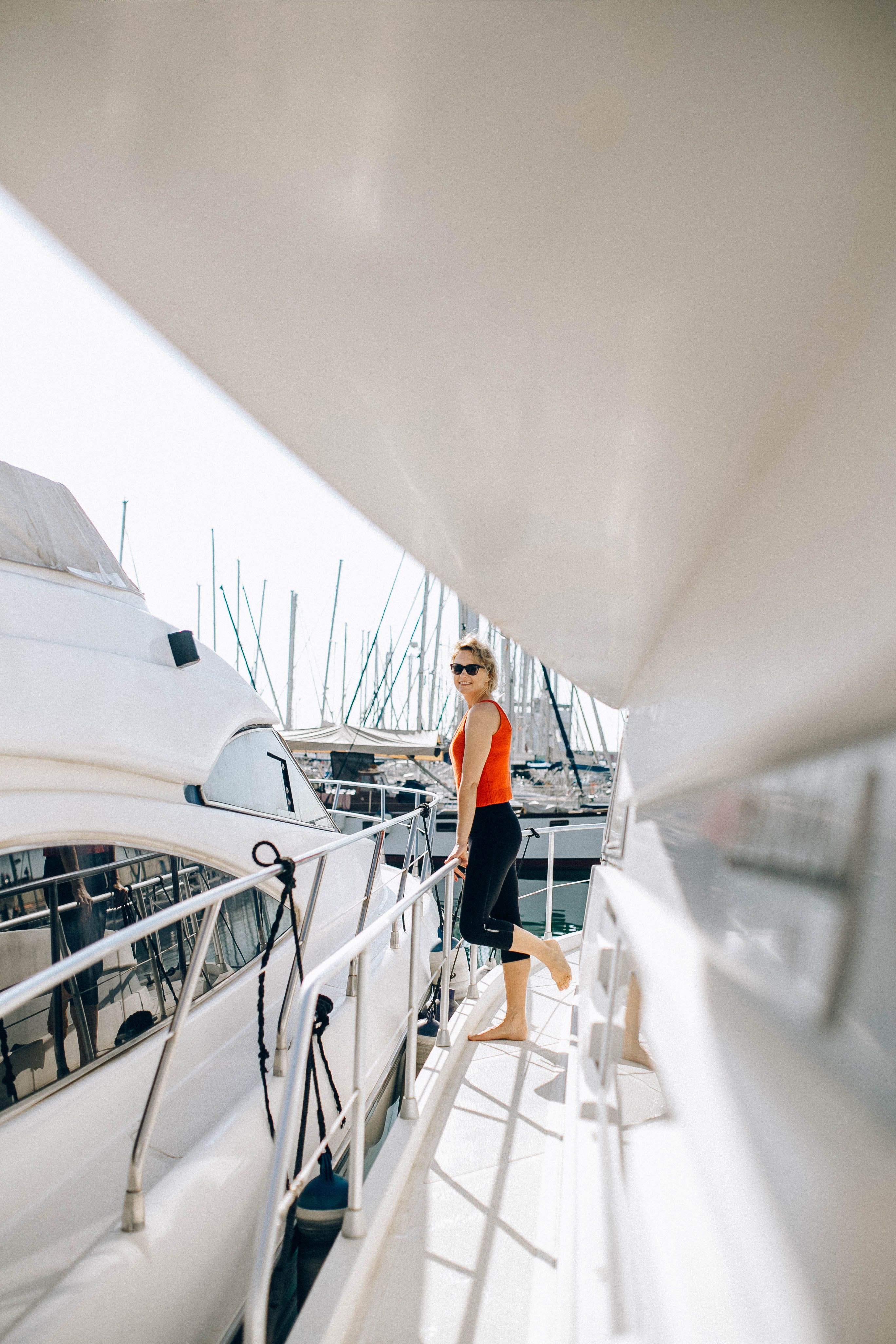 Modern yacht interior showing practical toilet area with space-saving bidet attachment