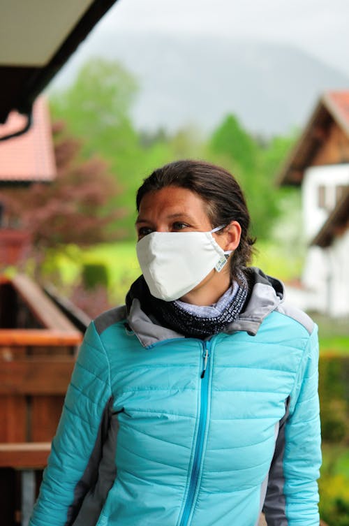 A Woman in Blue Jacket Wearing a Face Mask