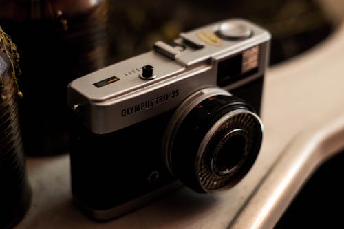 From above of historic model of vintage film camera placed on shelf in studio